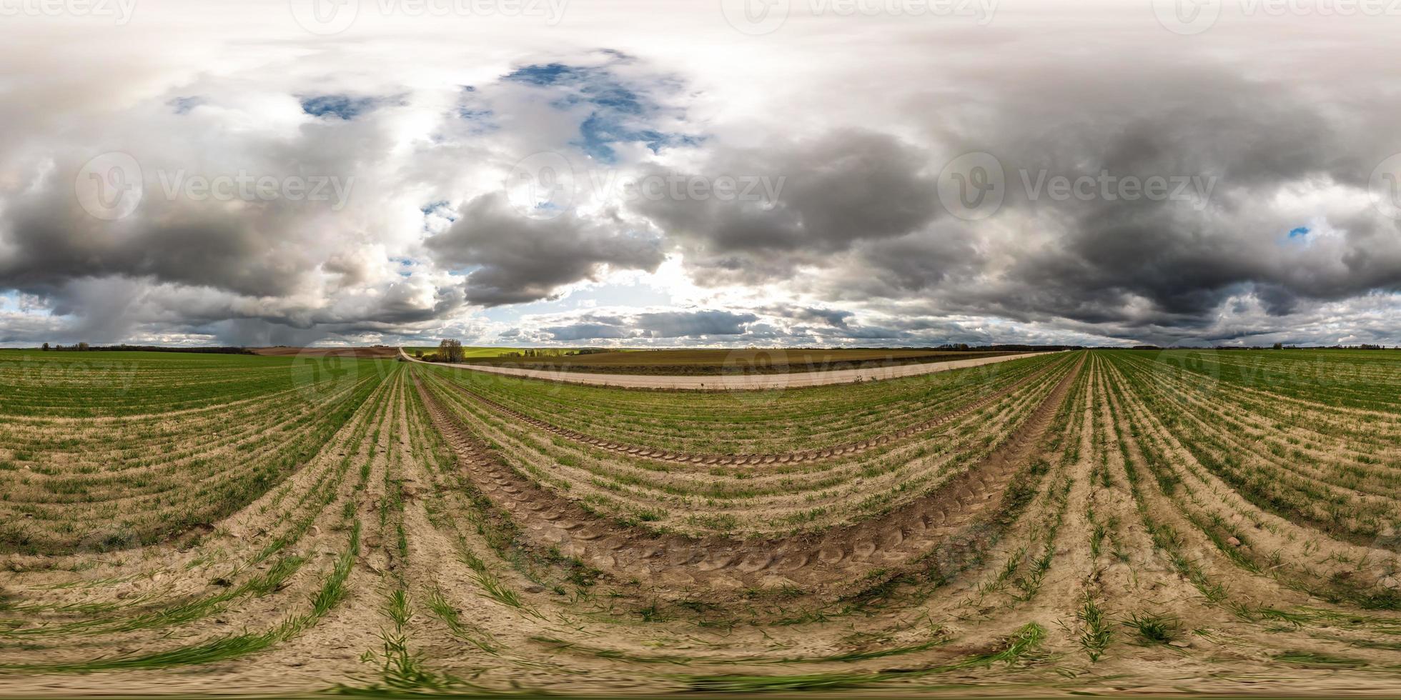 full seamless spherical hdri panorama 360 degrees angle view among fields in autumn day with awesome rain clouds in equirectangular projection, ready for VR AR virtual reality photo