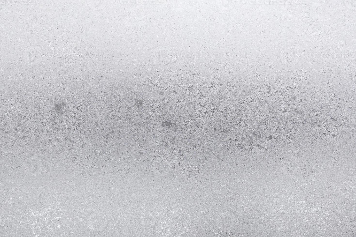 frost on surface of home window in urban houses photo