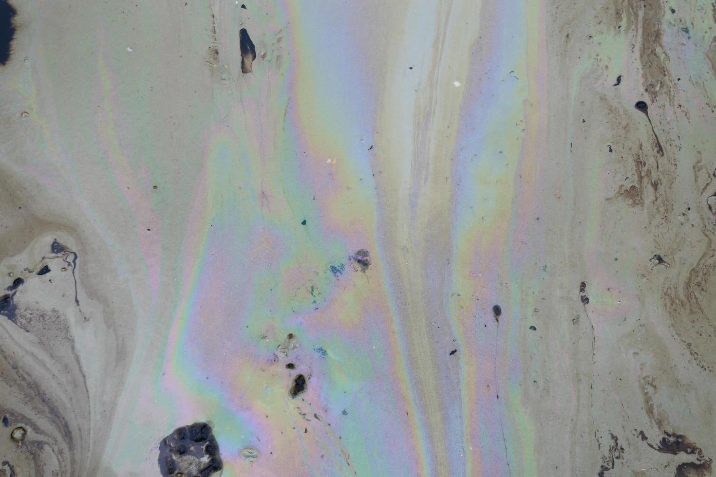 crude oil in sea water and rainbow reflection photo