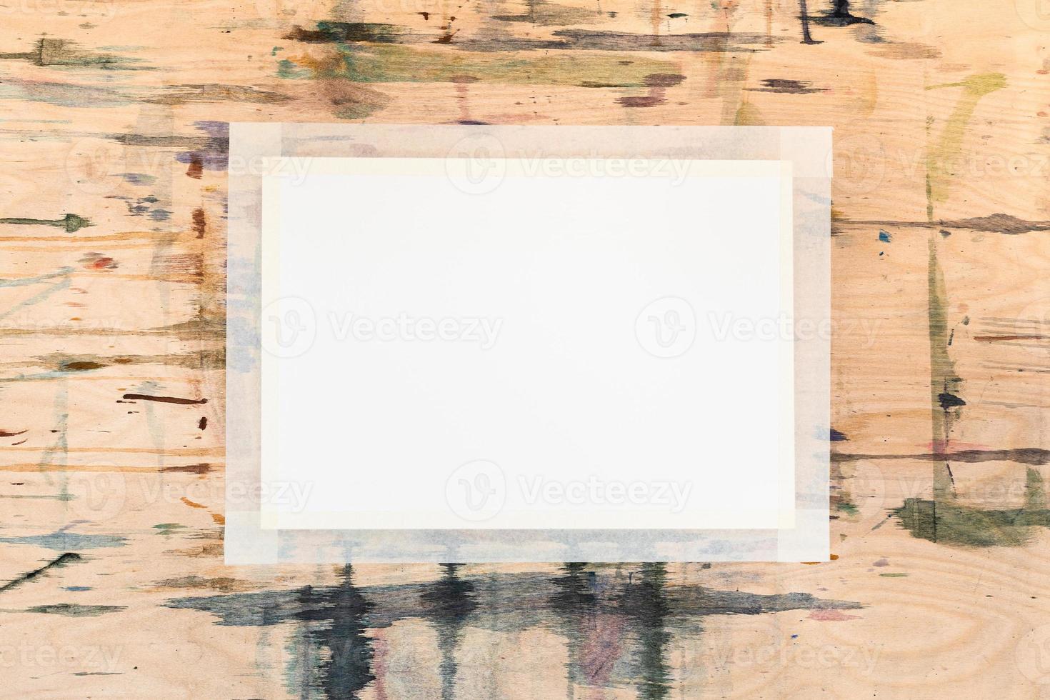blank white sheet of paper on wooden tablet photo