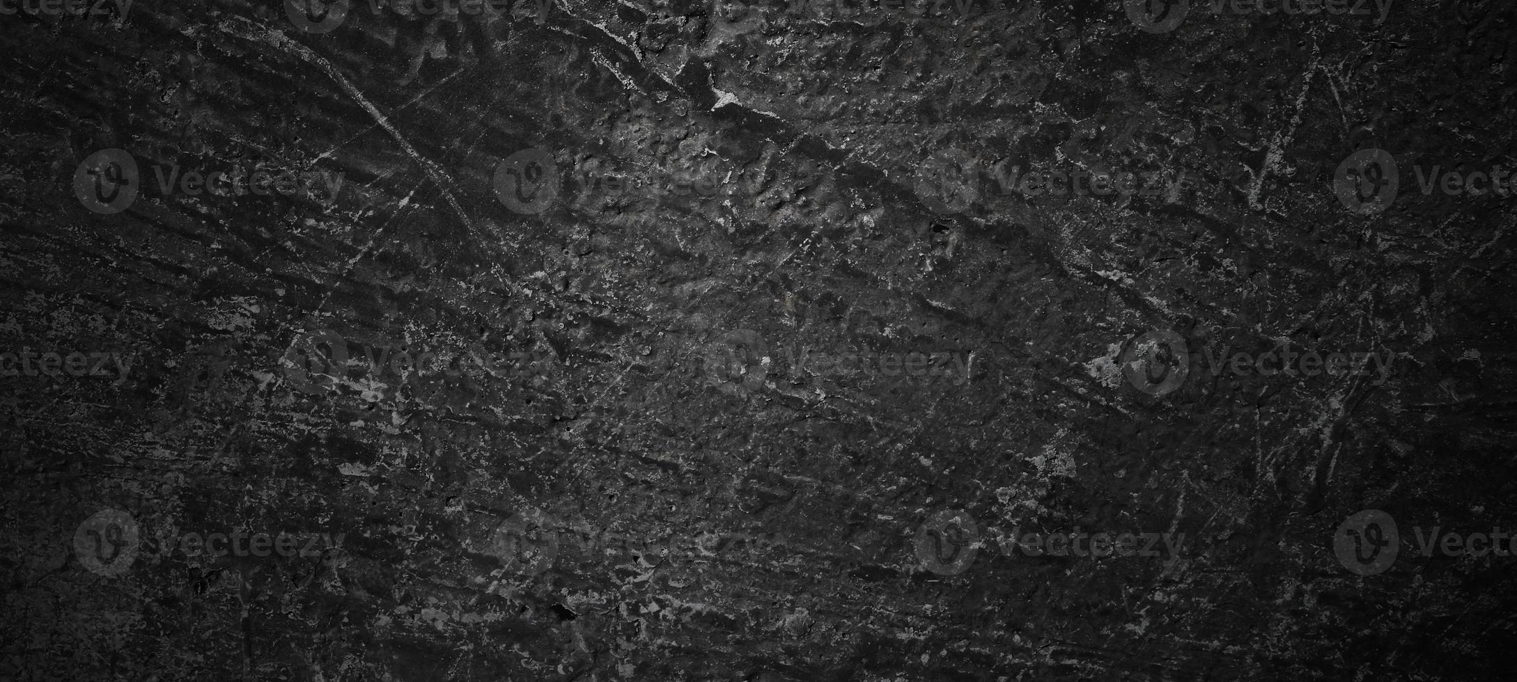 Dark black stone background. scary black concrete texture. Stone wall background. photo