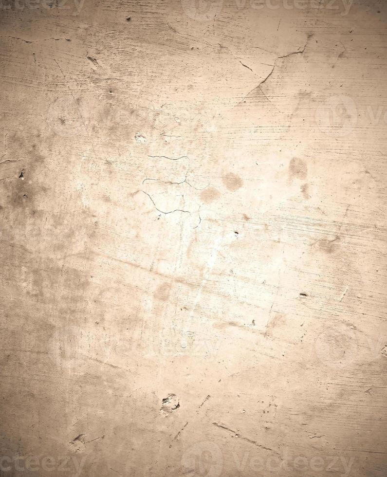 Old paper, old concrete, old wall texture with dark edges, stains, and cracks. photo