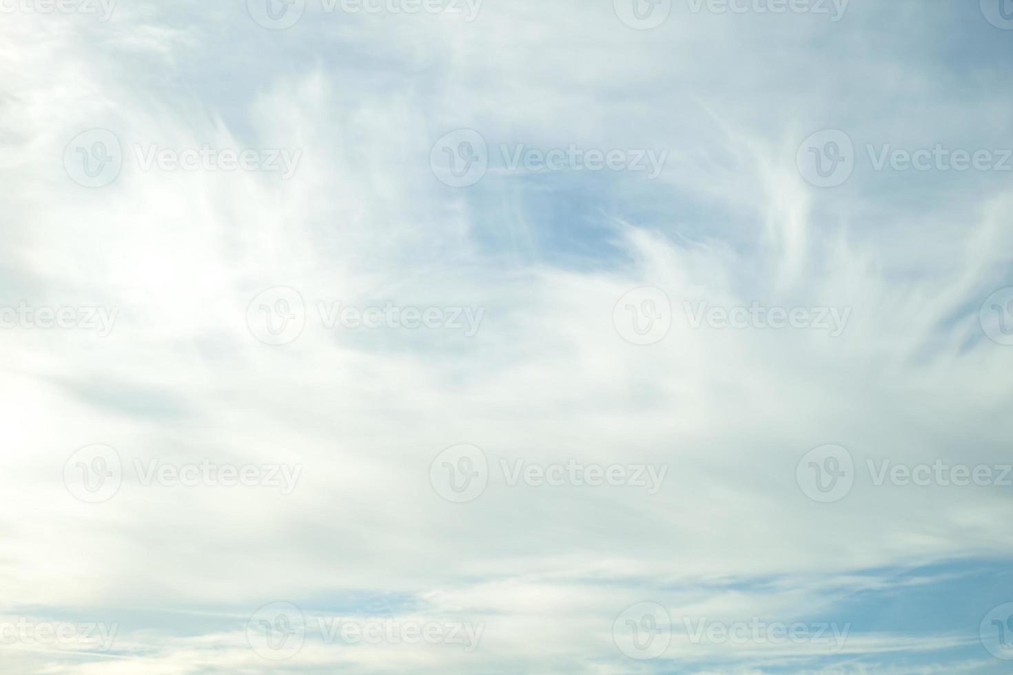 Blue sky background with tiny stratus cirrus striped clouds. Clearing day and Good windy weather photo