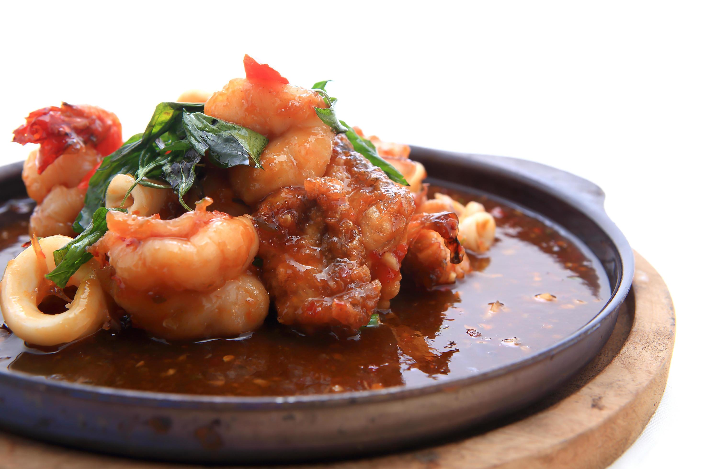 seafood stir fried with Thai herb. 10324393 Stock Photo at Vecteezy