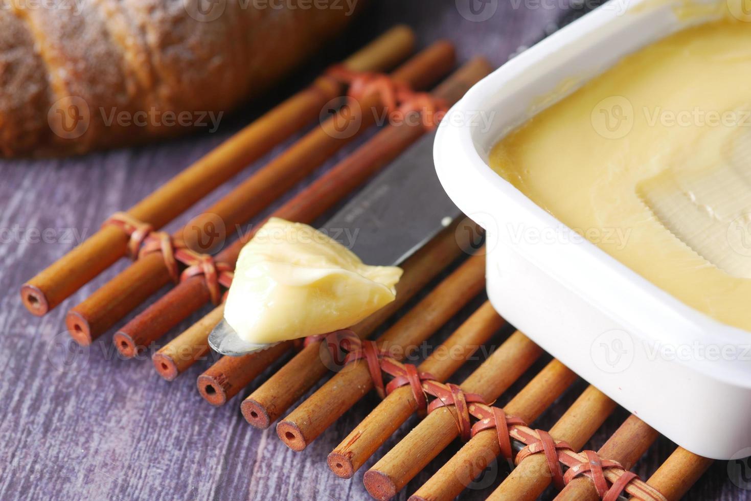 close up of fresh butter in a container photo