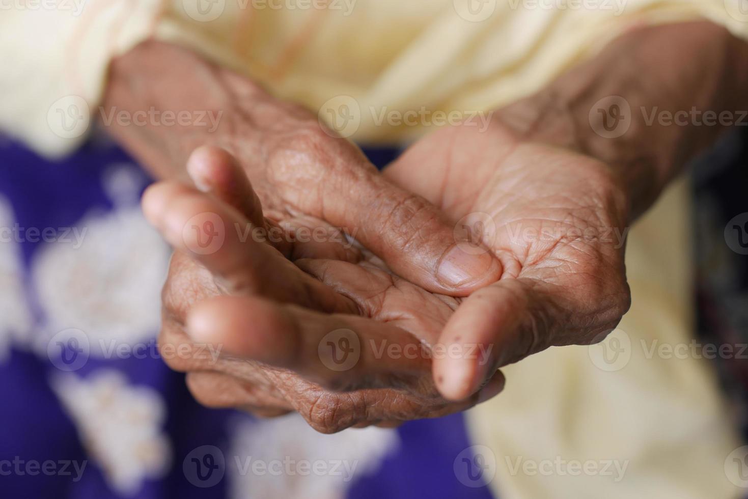 Elderly woman suffering from pain. photo