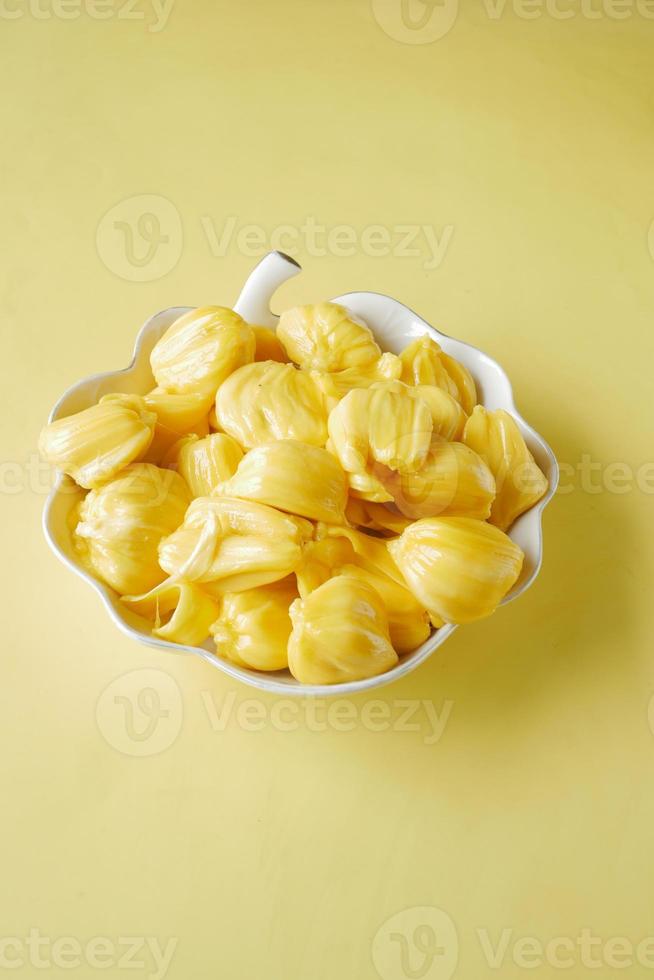 top view of slice of jackfruits in a bowl on table. photo