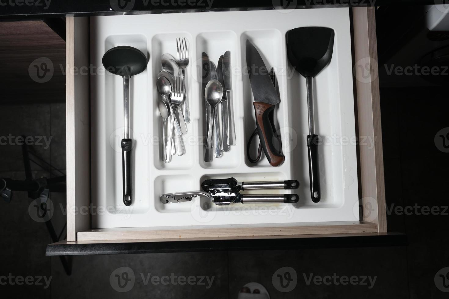 cutlery fork with knife and spoon in a drawer photo