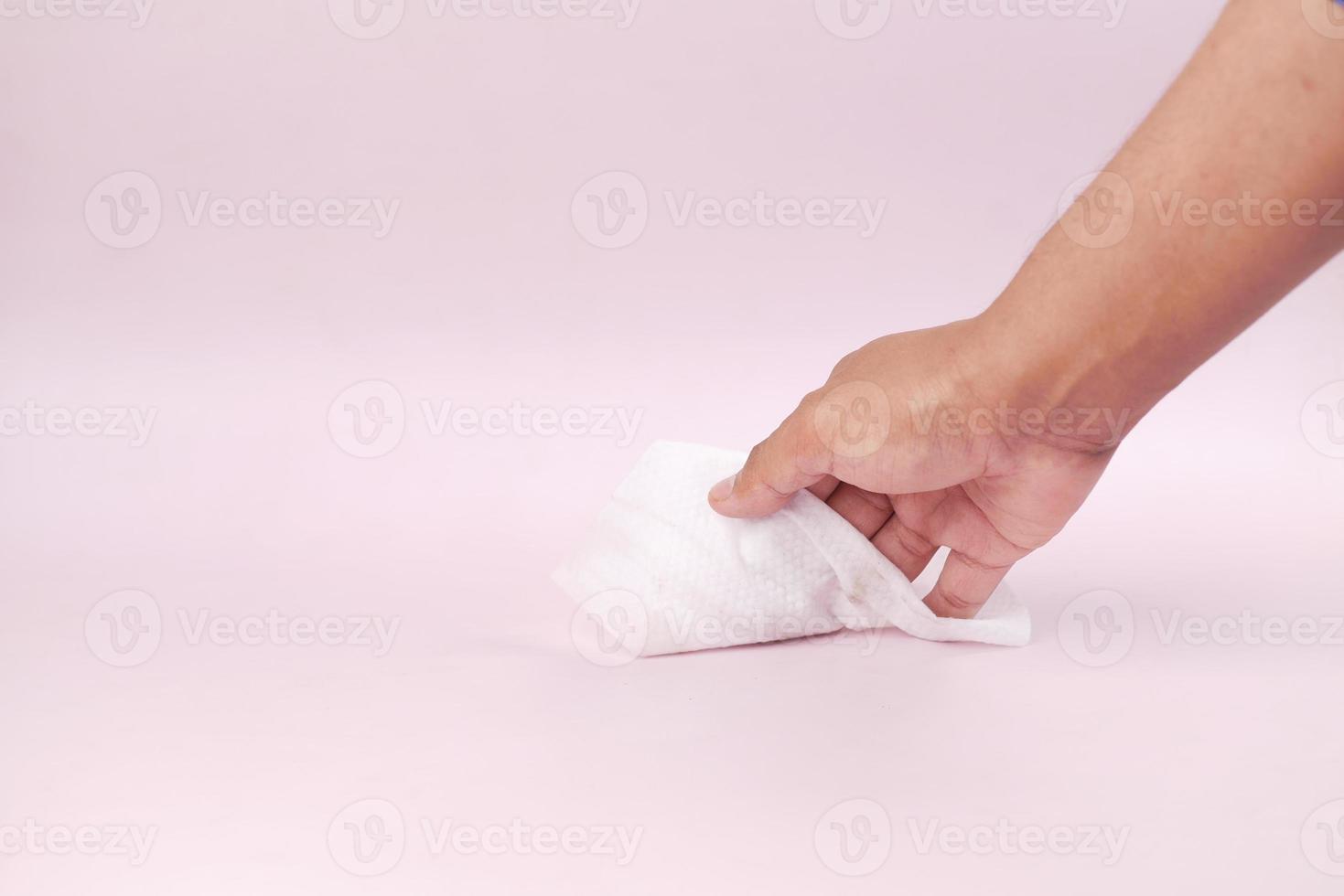 person hand cleaning table with cloth photo