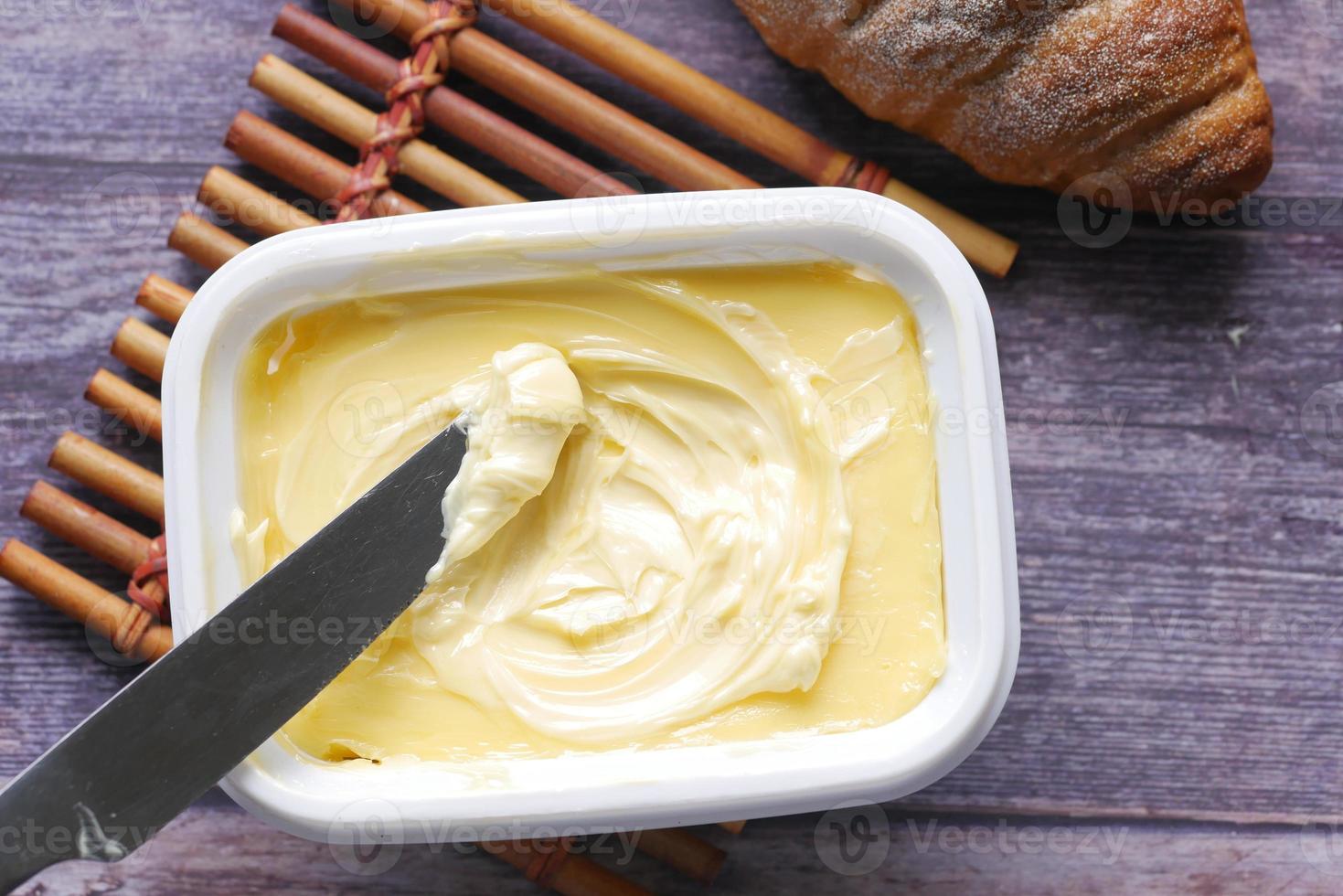 close up of fresh butter in a container photo