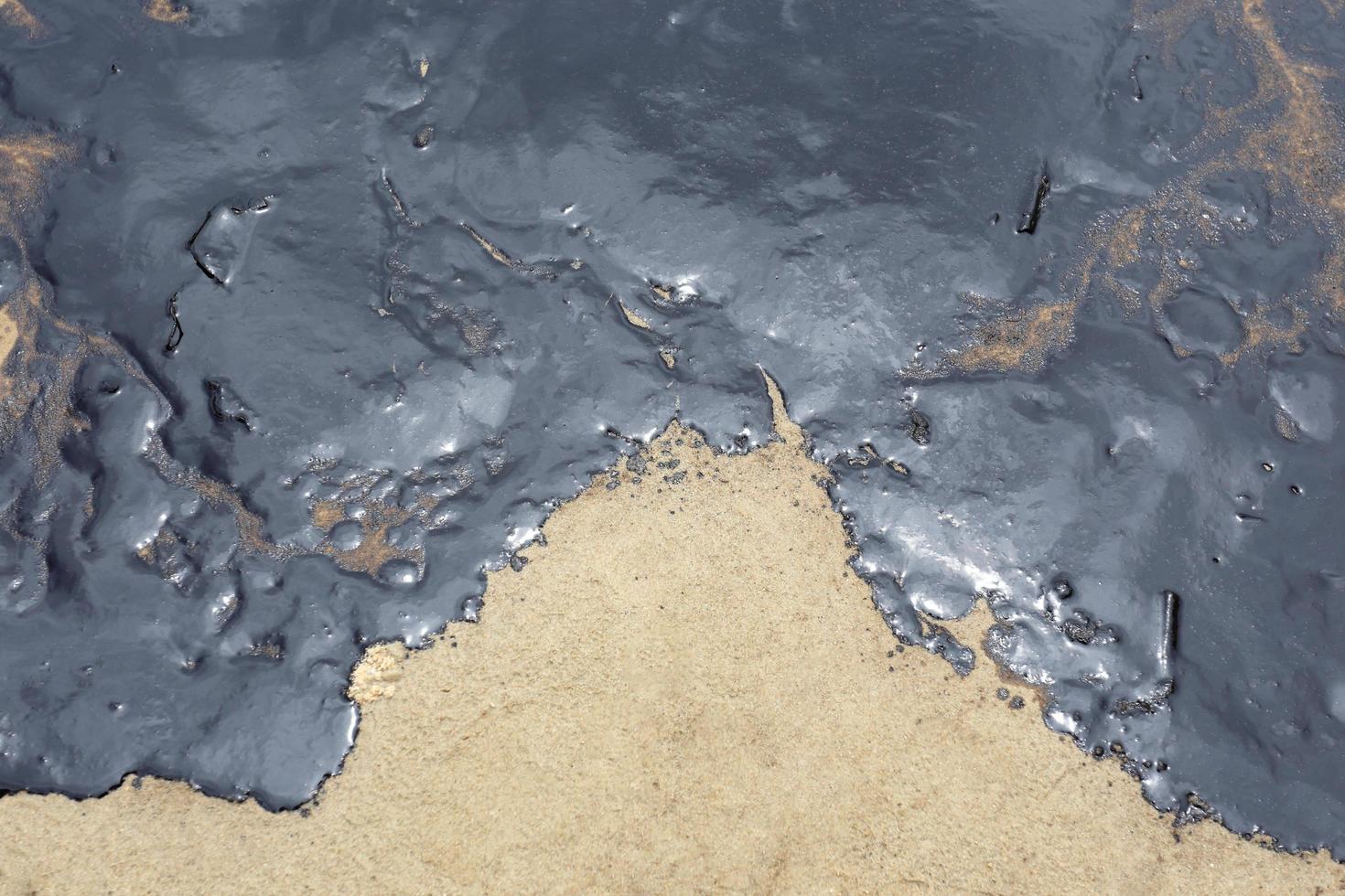 Gulf oil spill is shown on a beach photo