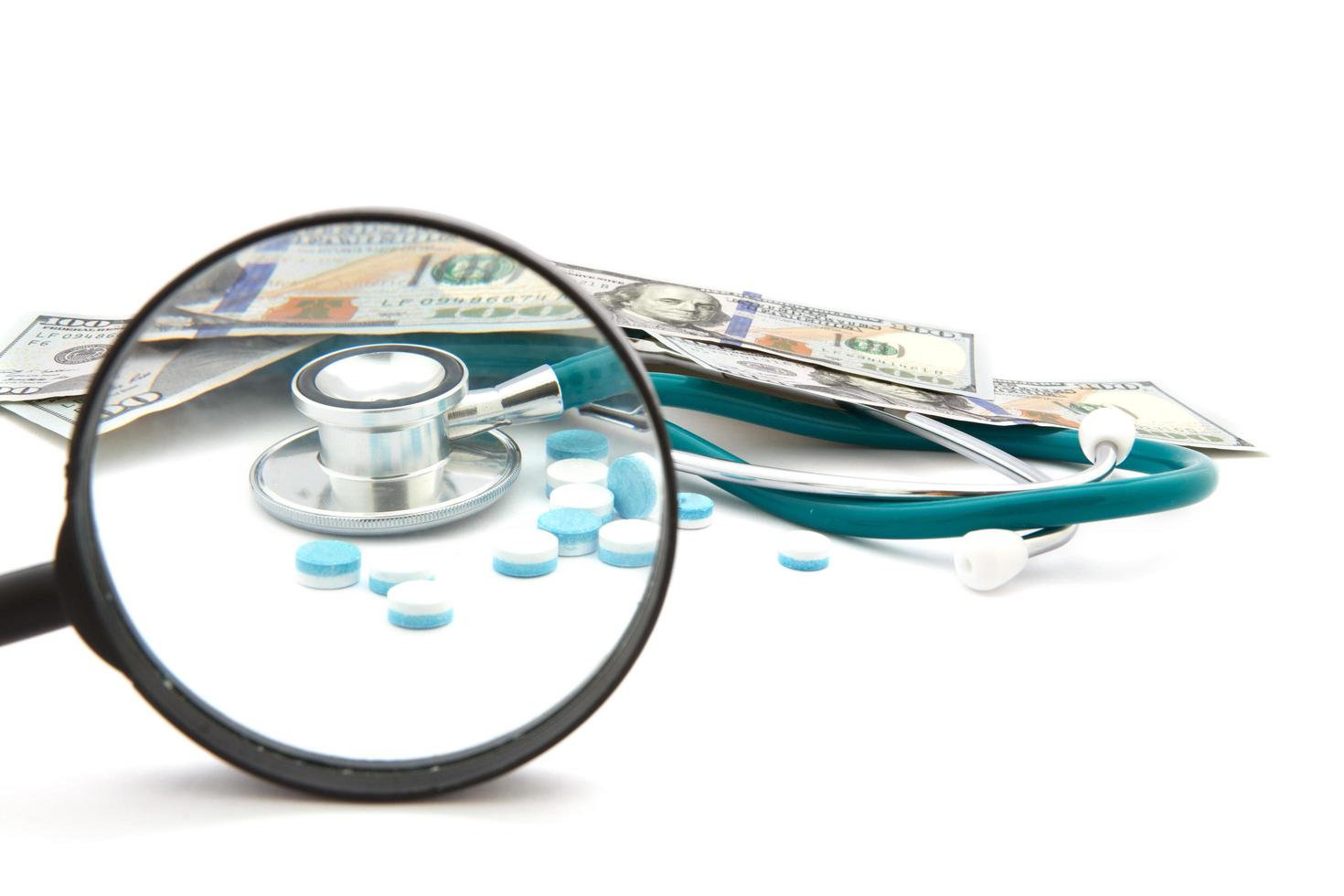 health care costs - Stethoscope on money background photo