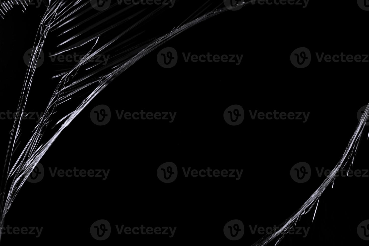 a black transparent plastic texture with hole for poster and cover art. realistic plastic wrap for overlay, copy space and photo effect. wrinkled plastic surface on black background