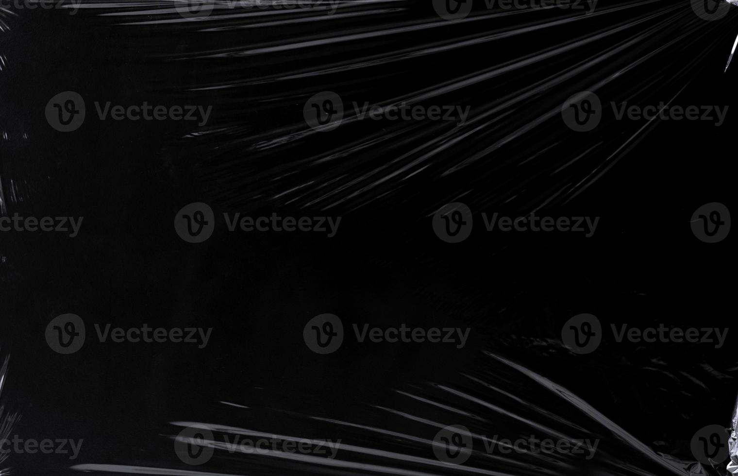Black transparent plastic wrap texture overlay background. Realistic plastic for poster design and photo overlay effect. Wrinkled plastic surface pattern for graphic design sources and element.