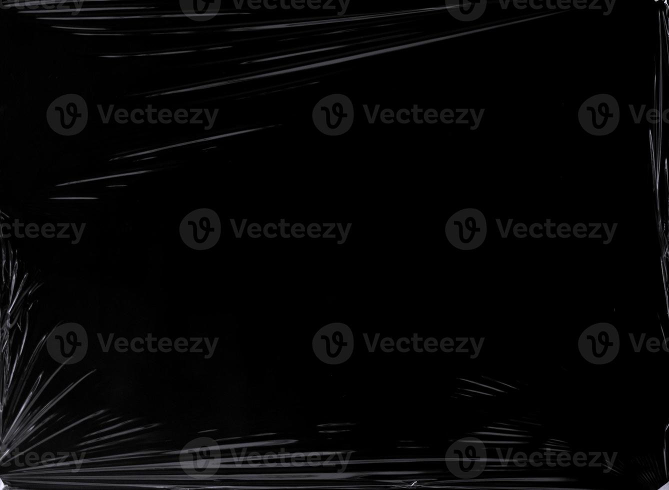 Black transparent plastic wrap texture overlay background. Realistic plastic for poster design and photo overlay effect. Wrinkled plastic surface pattern for graphic design sources and element.