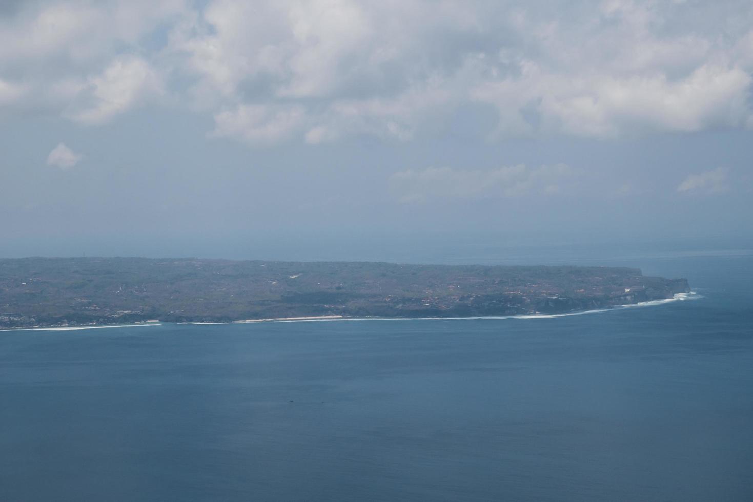 Bali island in tropical sea, veiw from airplane sight photo