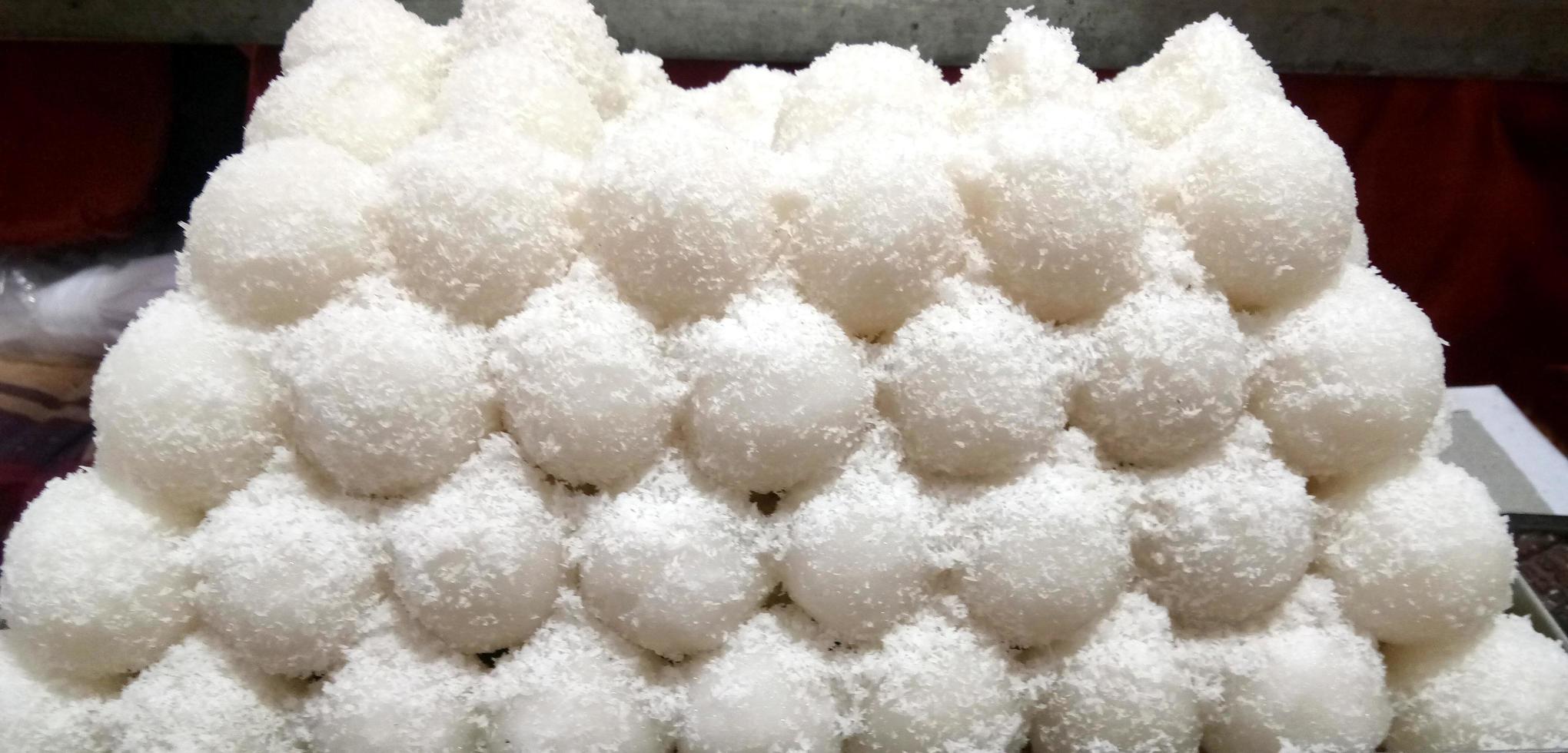 Coconut Sweet Laddoo OR Nariyal Ladduis a Popular Festival food from India. Served over moody background, selective focus photo