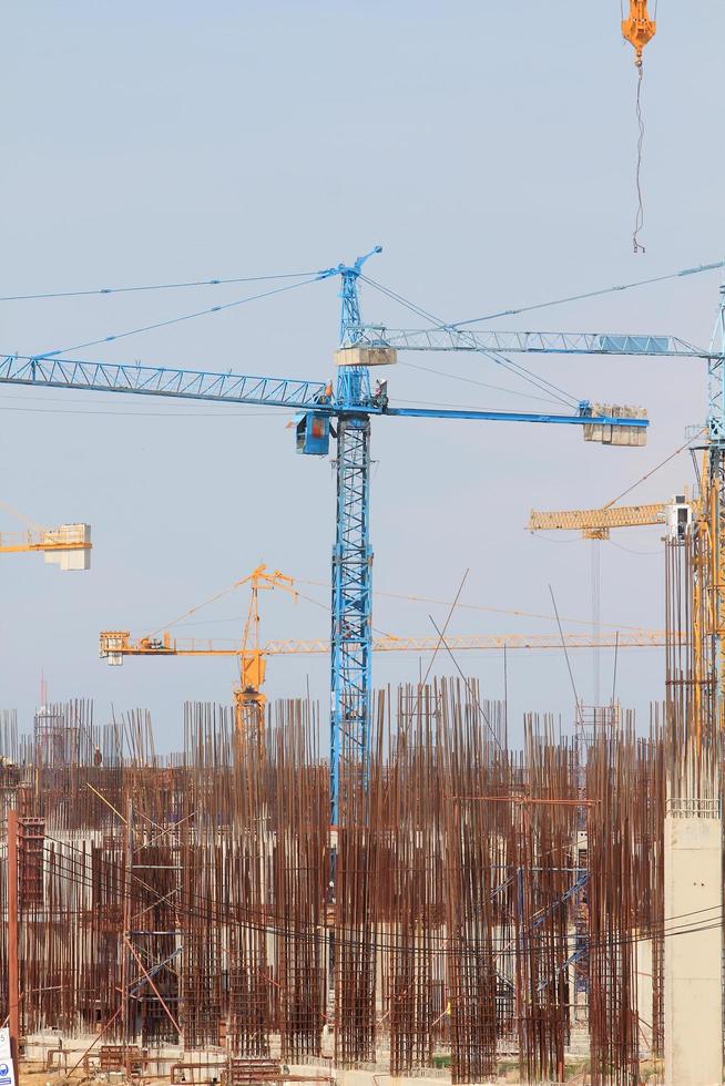 Construction site with enforced concrete steel frames rising up photo