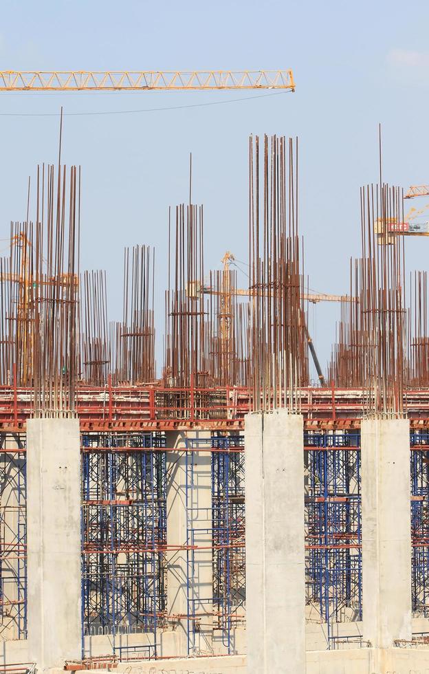 Construction site with enforced concrete steel frames rising up photo