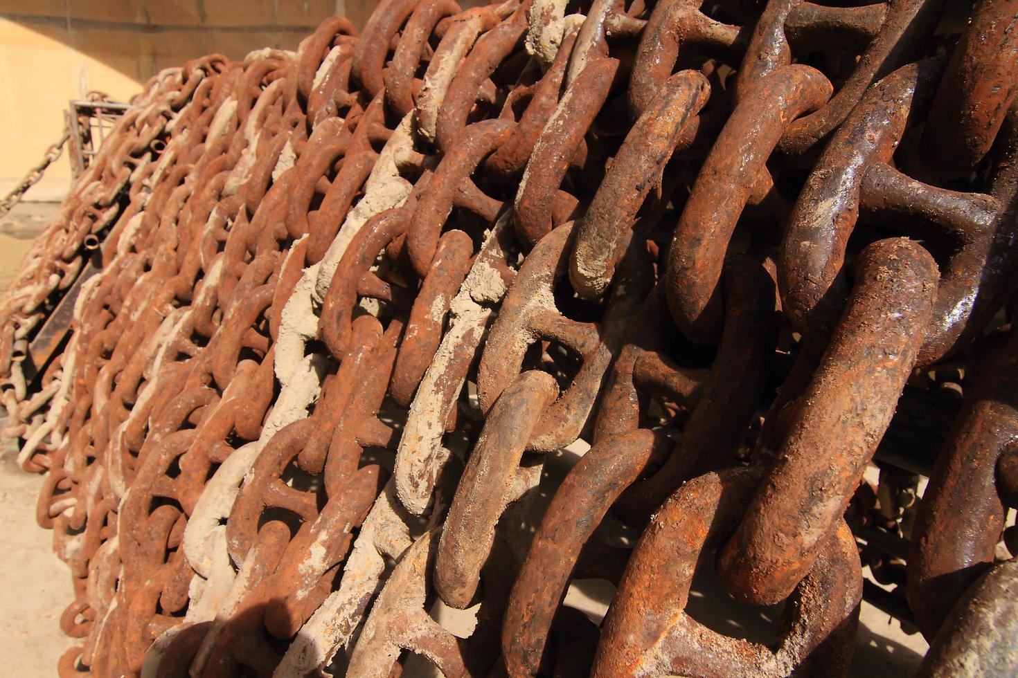 Old rusty ship anchor chain links close up. photo