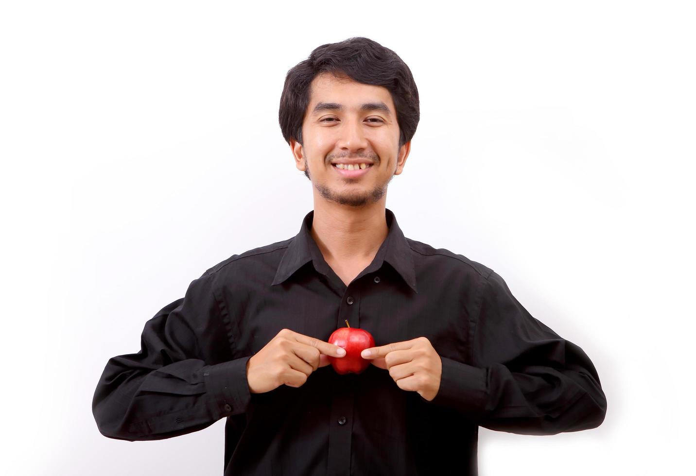 Healthy living. Man holding a red apple photo