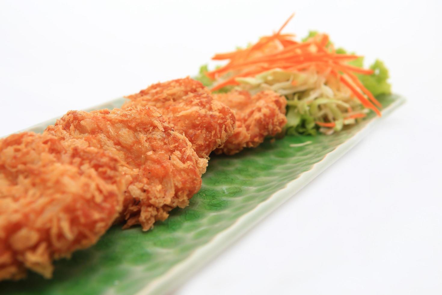 Fried shrimp cake, served on white dish photo