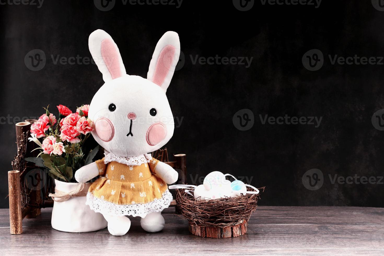 Easter rabbit with colorful eggs photo