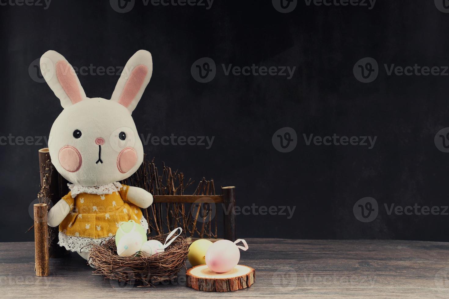 Easter rabbit with colorful eggs photo