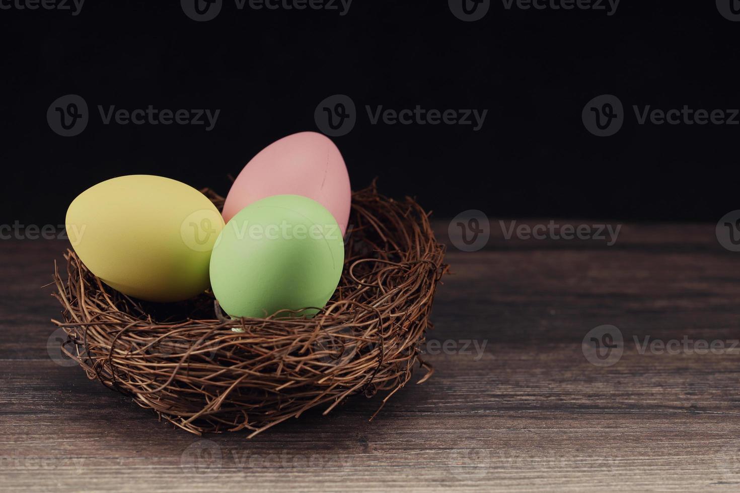 Easter rabbit with colorful eggs photo