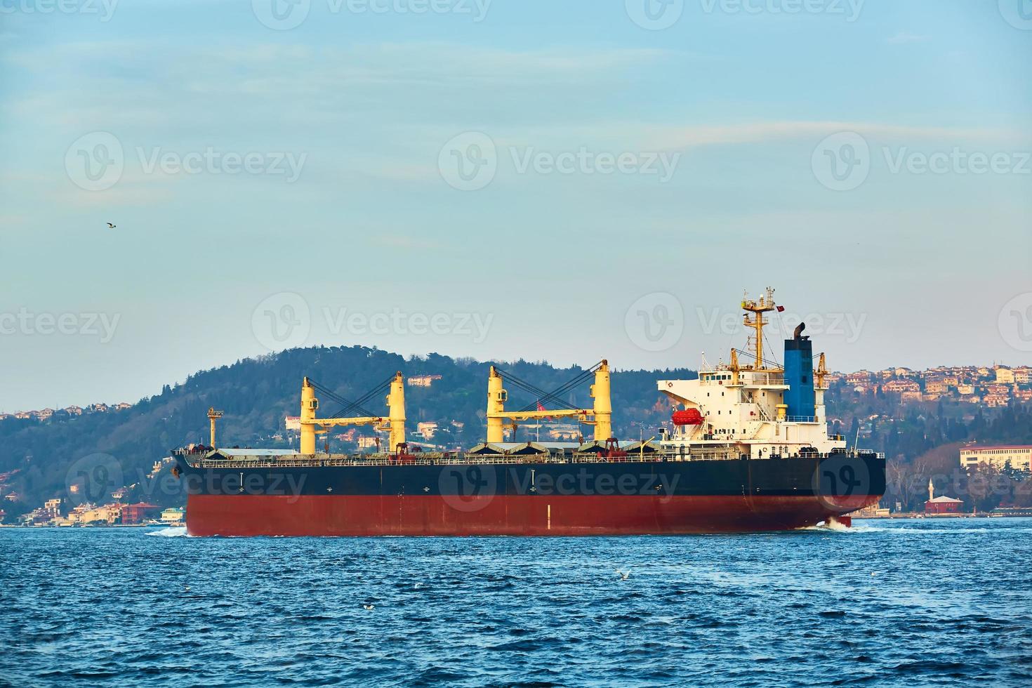 Bulk carrier in Bosphorus Strait, Istanbul, Turkey photo