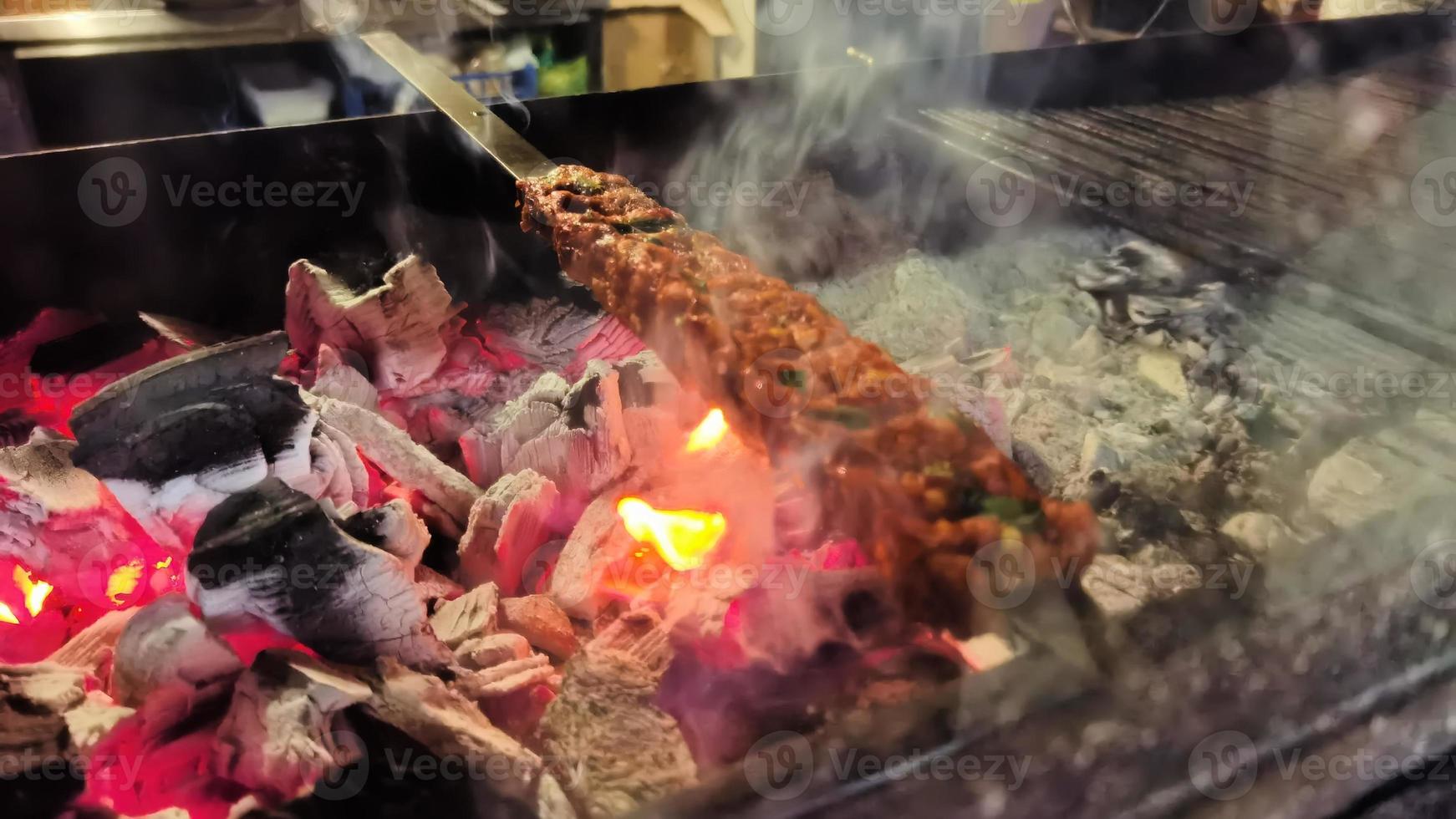 Uncooked shish kebab on a stick, from ground beef meat. Lula kebab, traditional Caucasian dish. photo