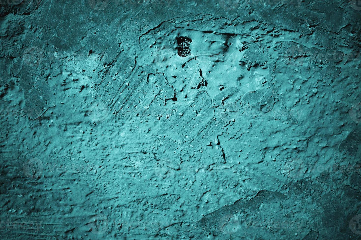 Abstract grunge blue stucco wall background. Dark stone wall concept background with space for text. photo