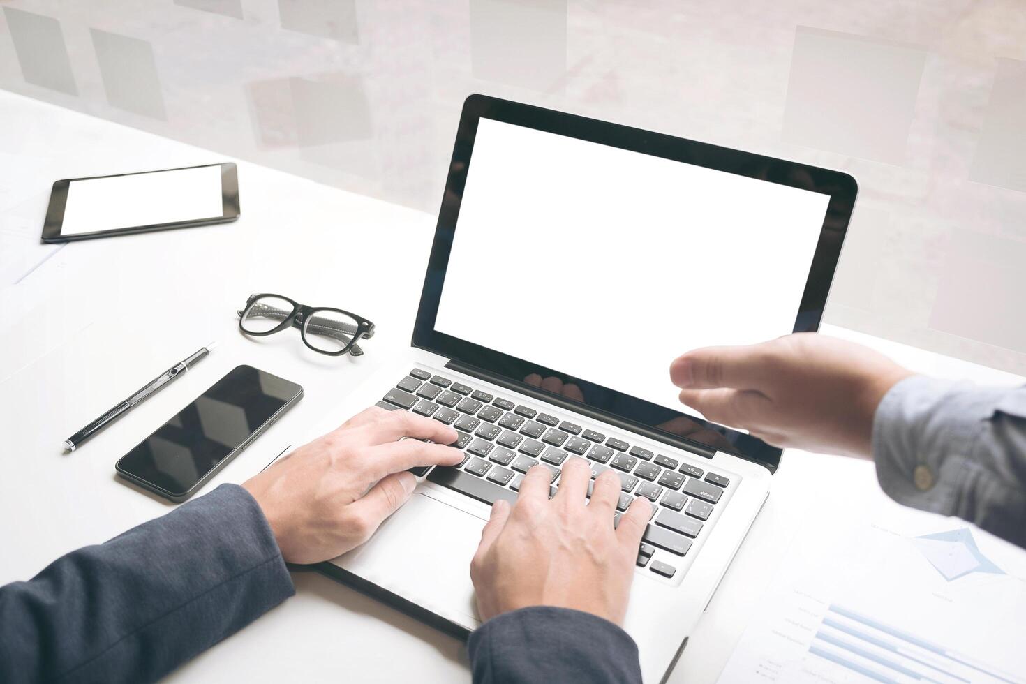 Team work process. Two businessman with laptop in open space office. Business concept photo