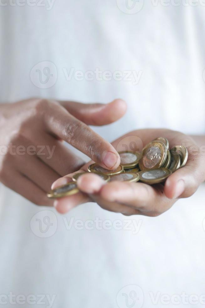 Close up of man hand counting coins photo