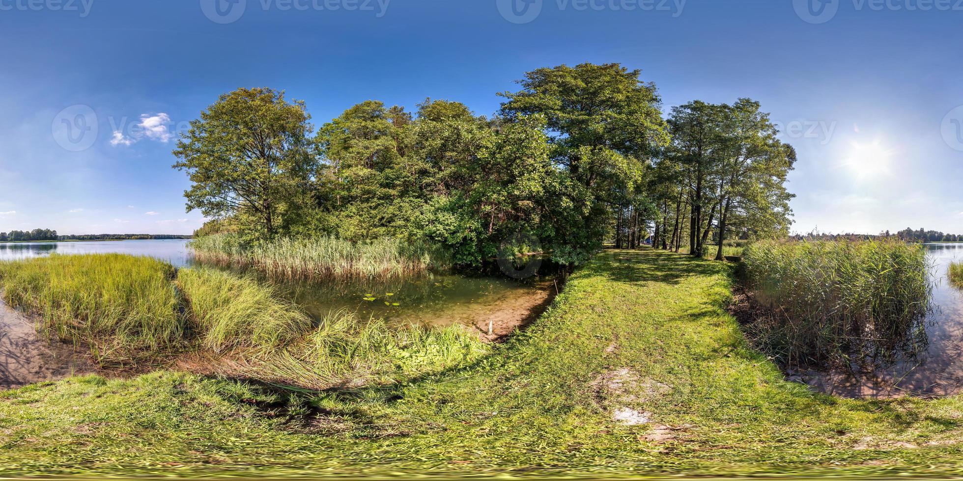 seamless spherical hdri panorama 360 degrees angle view on grass coast of huge river or lake in sunny summer day and windy weather in equirectangular projection with zenith and nadir, VR AR content photo