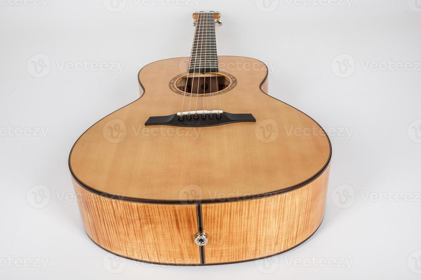 wood texture of lower deck of six strings acoustic guitar on white background. guitar shape photo