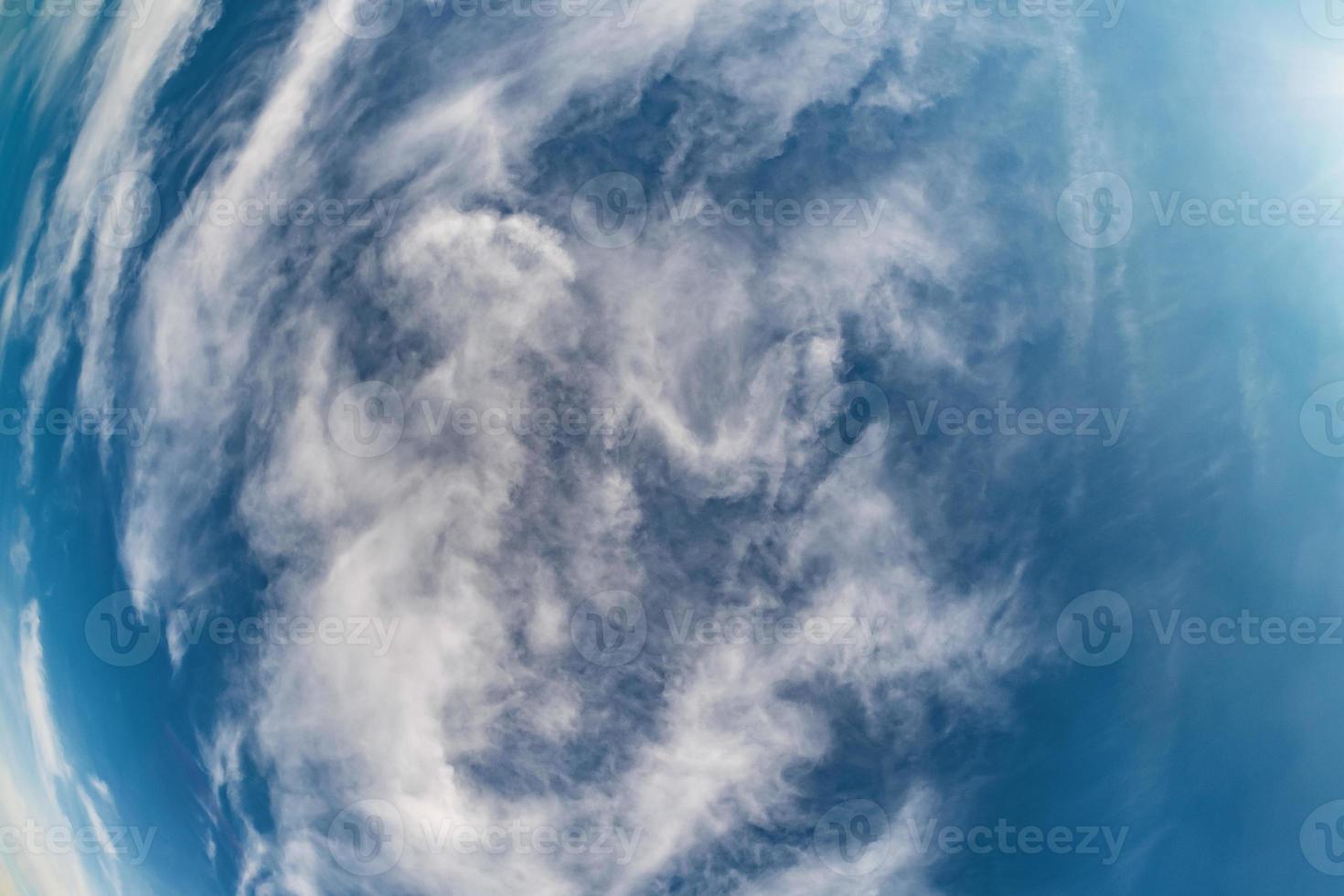 Blue sky background with tiny stratus cirrus striped clouds. Clearing day and Good windy weather photo