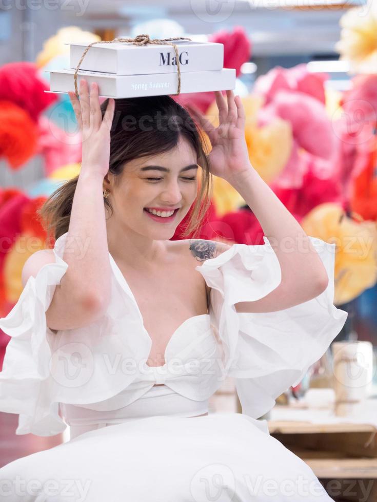 Portrait young  beautiful girl woman pretty smiling sitting attractive looking at book with a smile, happy and bright enjoy in dormitory university in home room . photo