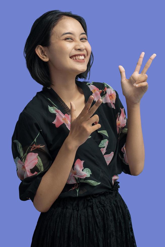 Young Asian Woman with Attractive Gesture photo