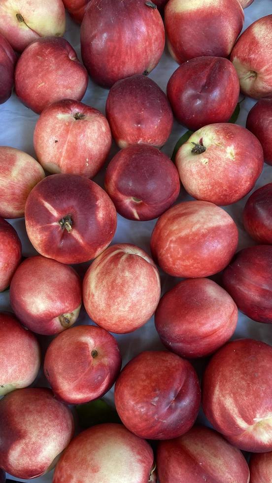 a beautiful fragrant ripe nectarine, the view from the top. photo