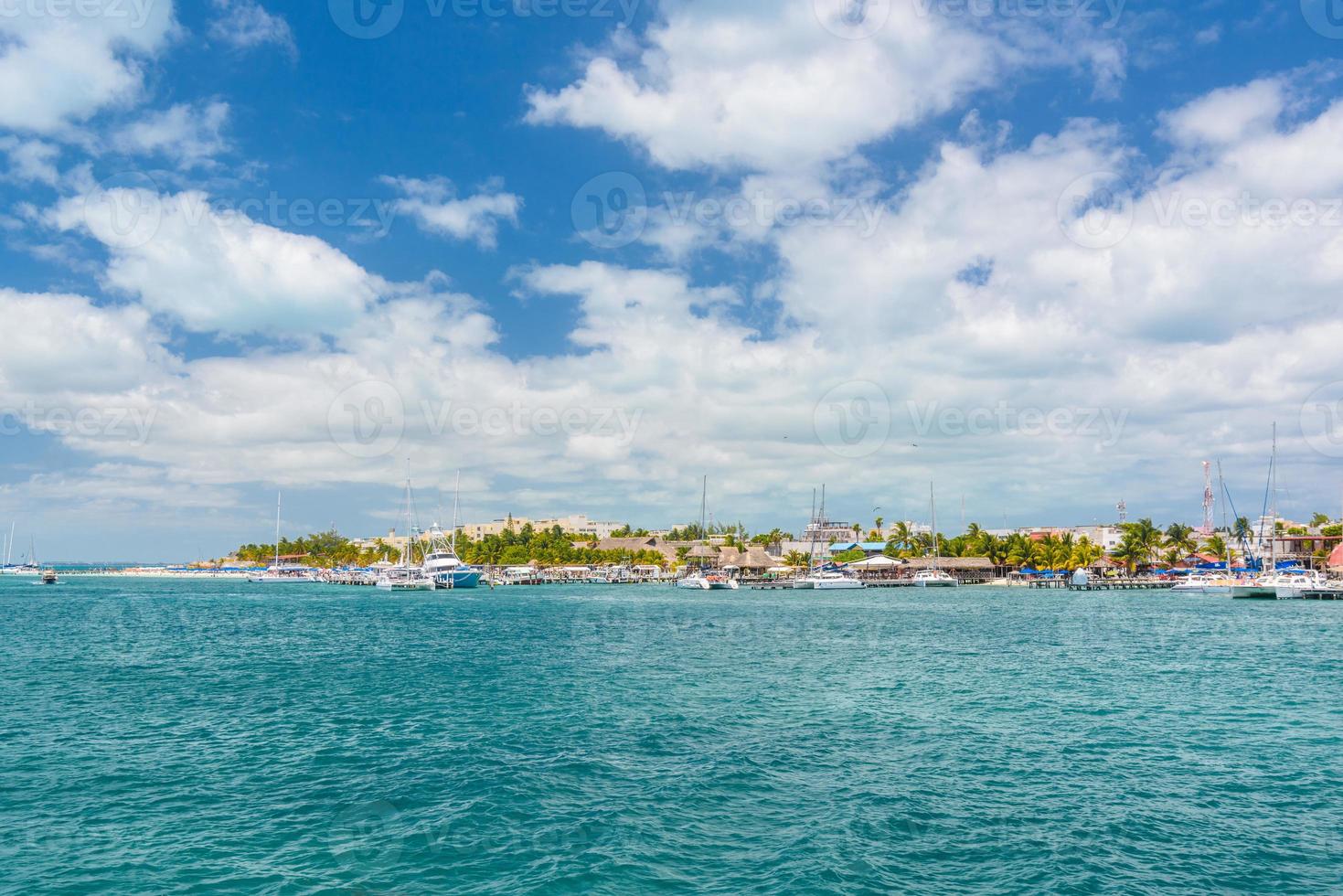 Port with sailboats and ships in Isla Mujeres island in Caribbean Sea, Cancun, Yucatan, Mexico photo
