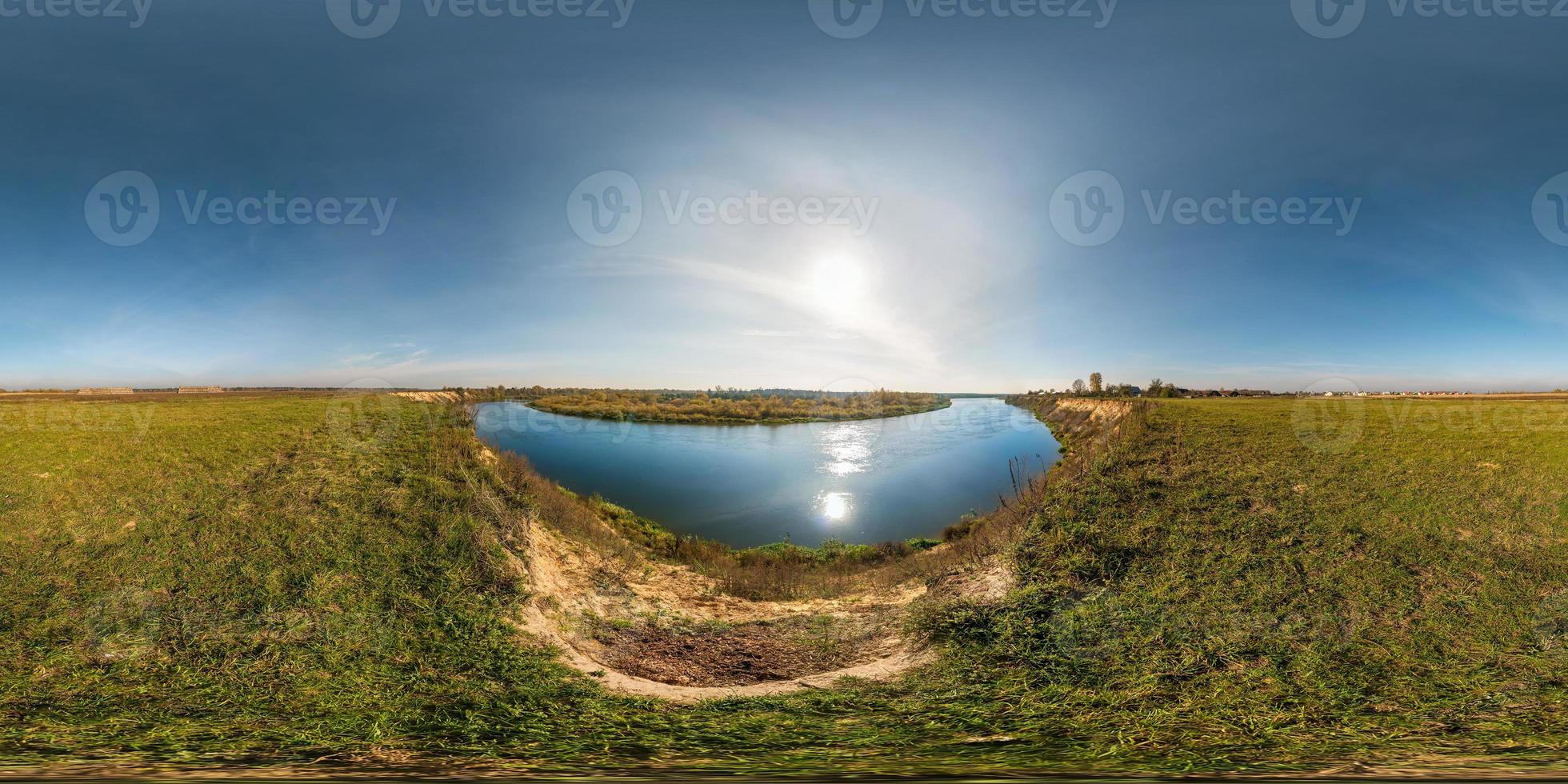 seamless spherical hdri panorama 360 degrees angle view on grass coast of huge river or lake in sunny summer day and windy weather in equirectangular projection with zenith and nadir, VR AR content photo