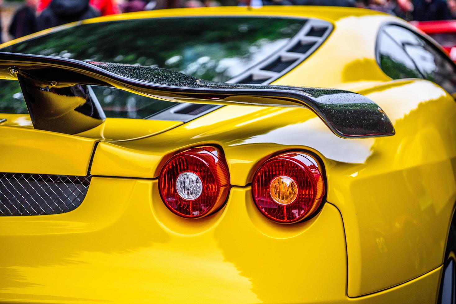 GERMANY, FULDA - JUL 2019 rearview lights of yellow FERRARI F430 Type F131 cabrio is a sports car produced by the Italian automobile manufacturer Ferrari from 2004 to 2009 as a successor to the Ferrar photo