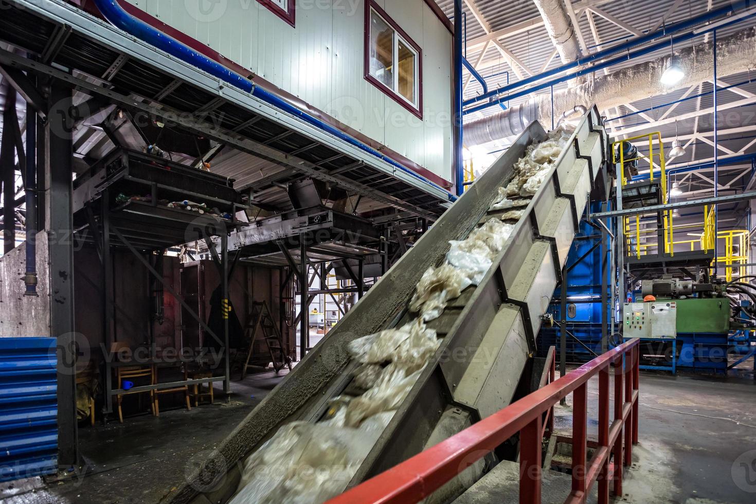 moving conveyor transporter on Modern waste recycling processing plant. Separate and sorting garbage collection. Recycling and storage of waste for further disposal. photo