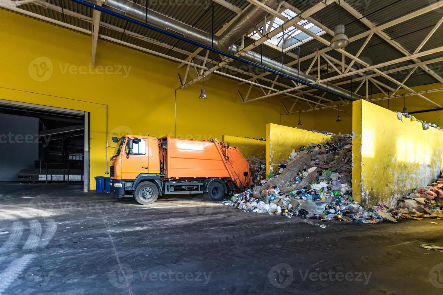 truck throws garbage at sorting modern waste recycling processing plant. Separate and sorting garbage collection. Recycling and storage of waste for further disposal. photo