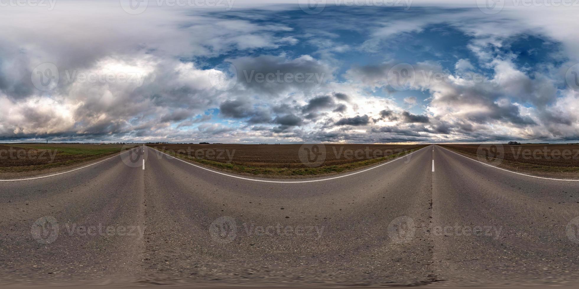full seamless spherical hdri panorama 360 degrees angle view on asphalt road among fields in autumn day with beautiful clouds in equirectangular projection, ready for VR AR virtual reality content photo