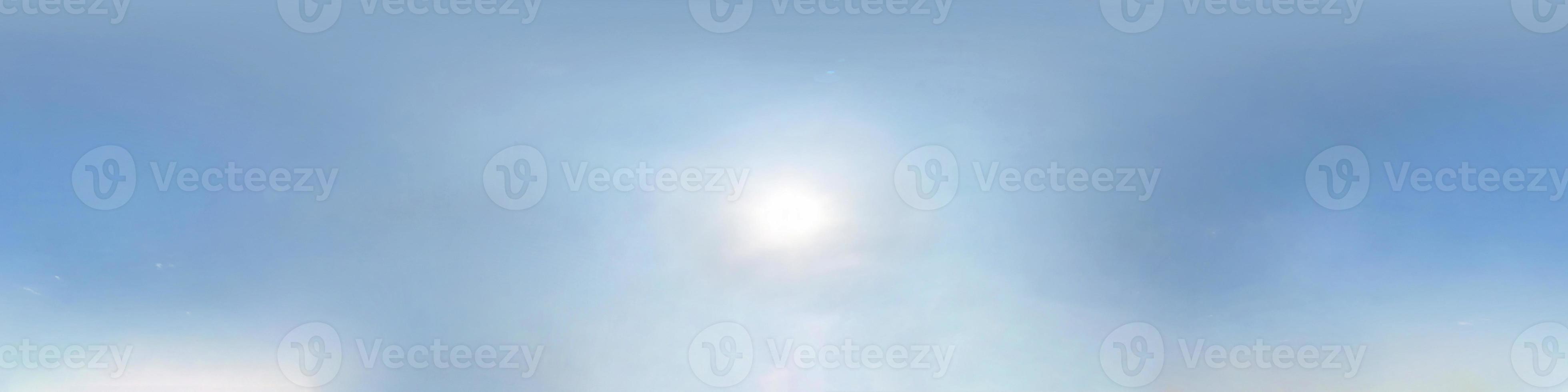 clear blue sky with halo sun. Seamless hdri panorama 360 degrees angle view with zenith for use in 3d graphics or game development as sky dome or edit drone shot photo