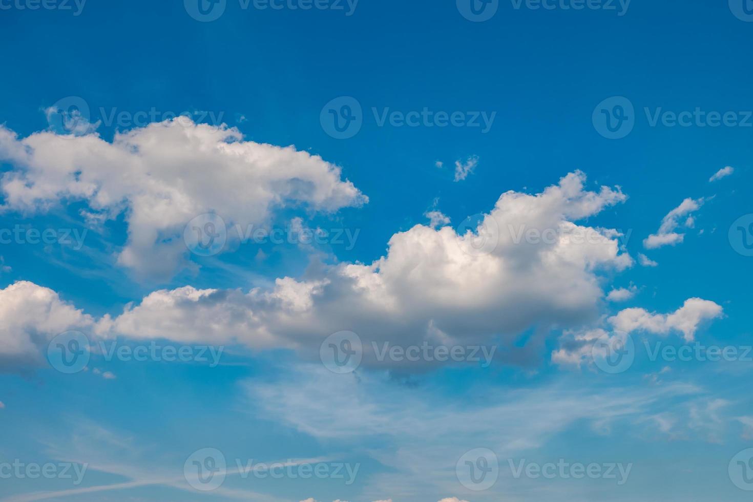 Blue sky background with tiny stratus cirrus striped clouds. Clearing day and Good windy weather photo