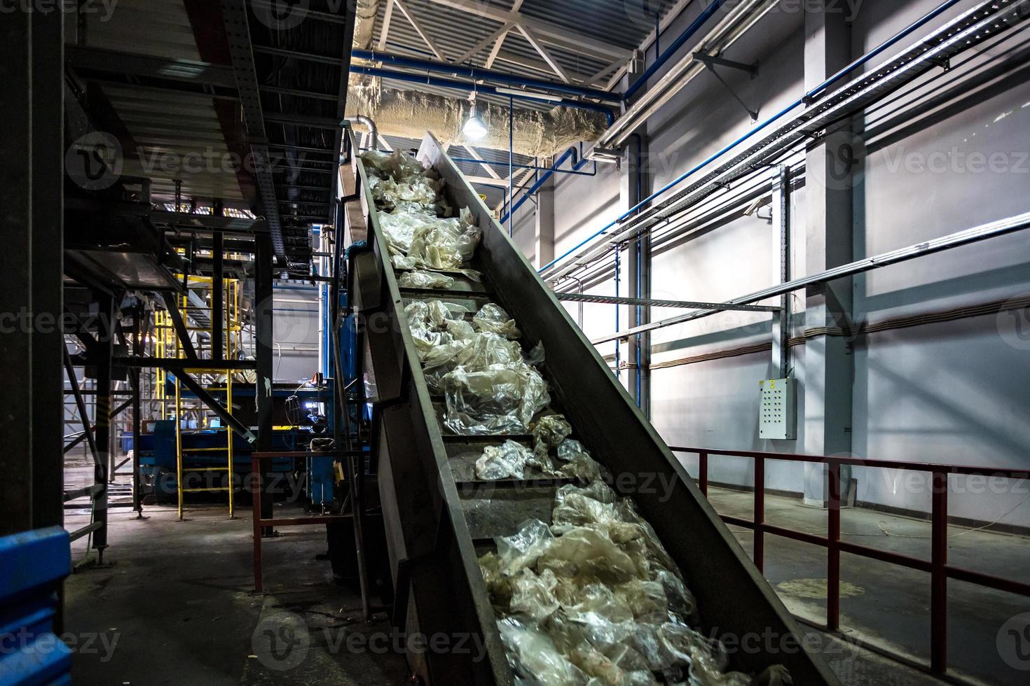 moving conveyor transporter on Modern waste recycling processing plant. Separate and sorting garbage collection. Recycling and storage of waste for further disposal. photo