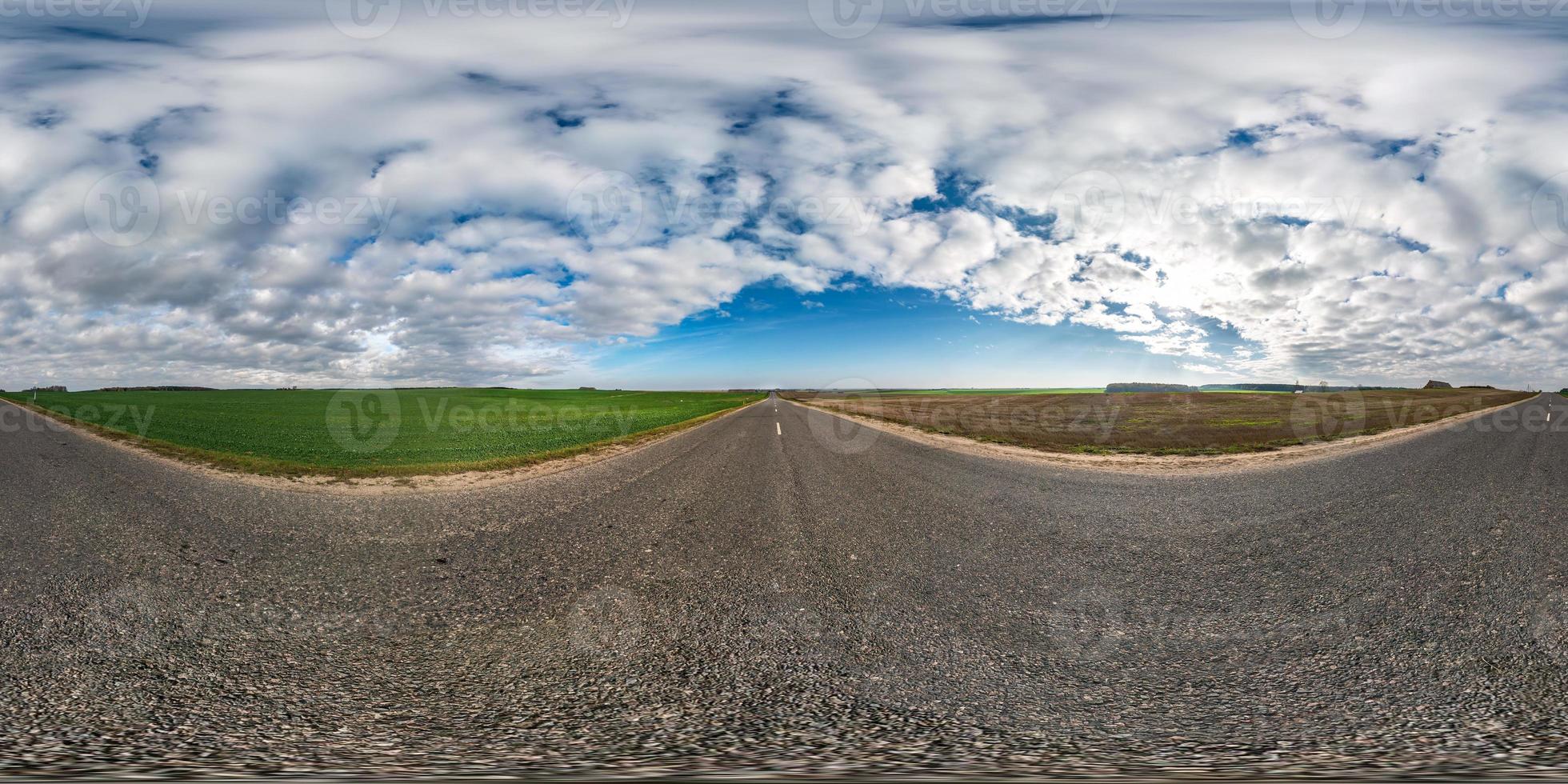 full seamless spherical hdri panorama 360 degrees angle view on asphalt road among fields in autumn day with beautiful clouds in equirectangular projection, ready for VR AR virtual reality content photo